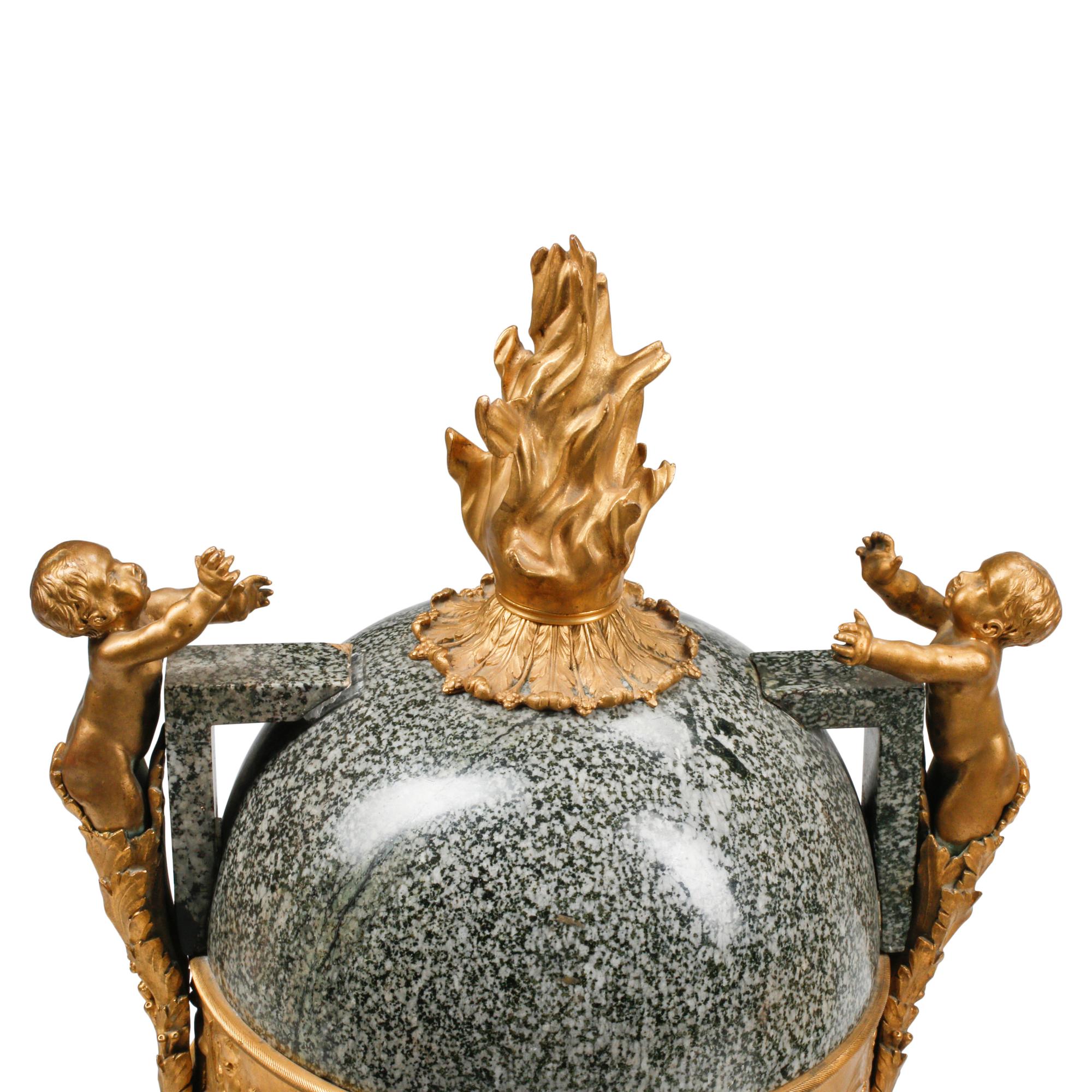 A Pair of Large French Gilt Bronze Mounted Marble Urns