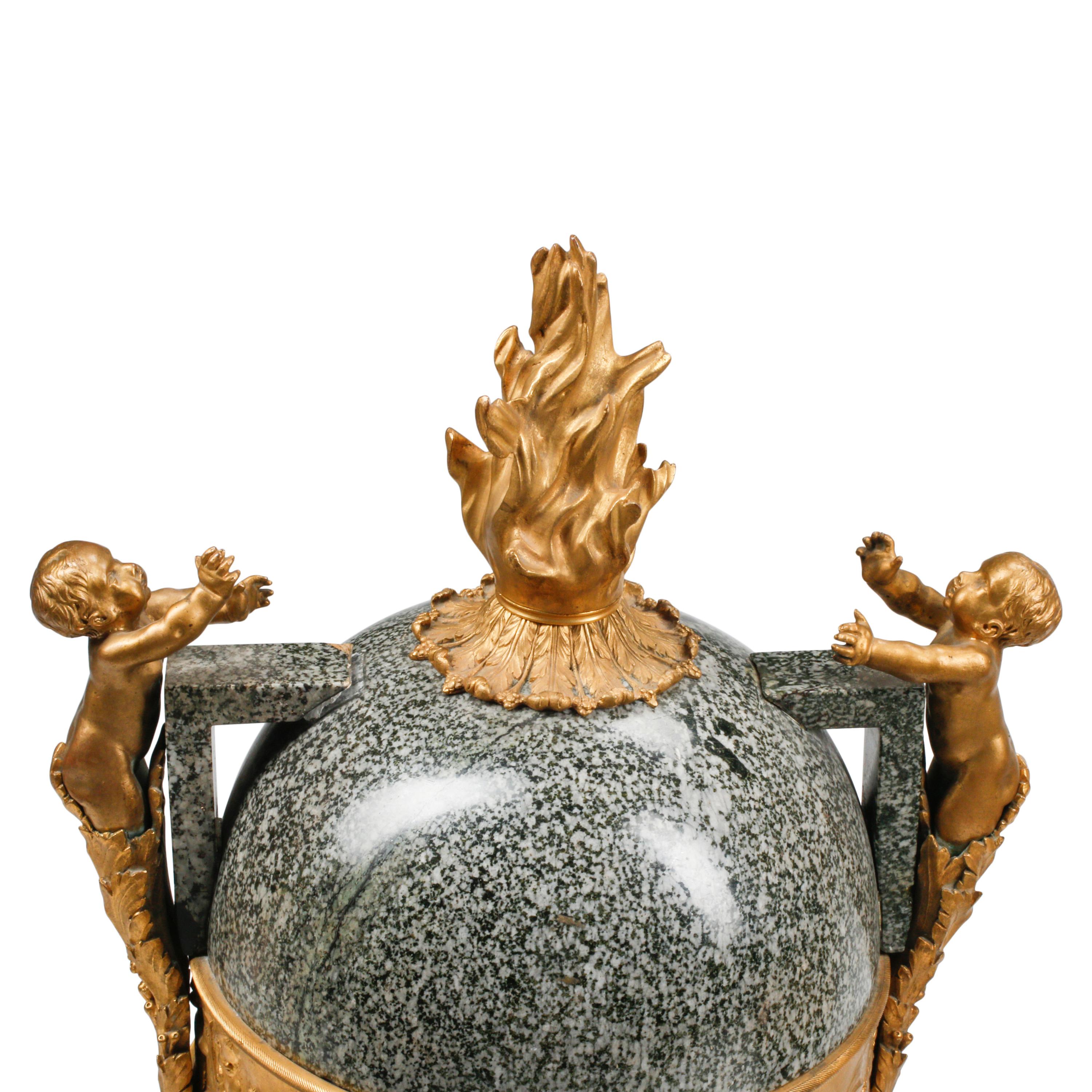 A Pair of Large French Gilt Bronze Mounted Marble Urns