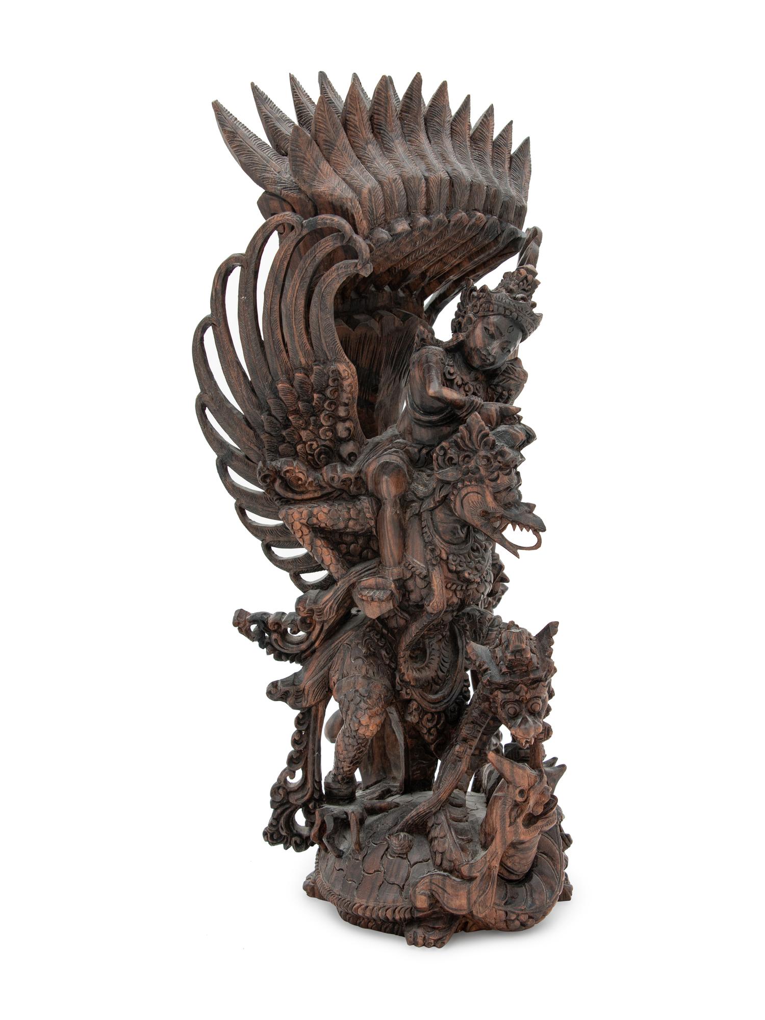 A Thai Carved Wood Figural Group of a Deity and Animals