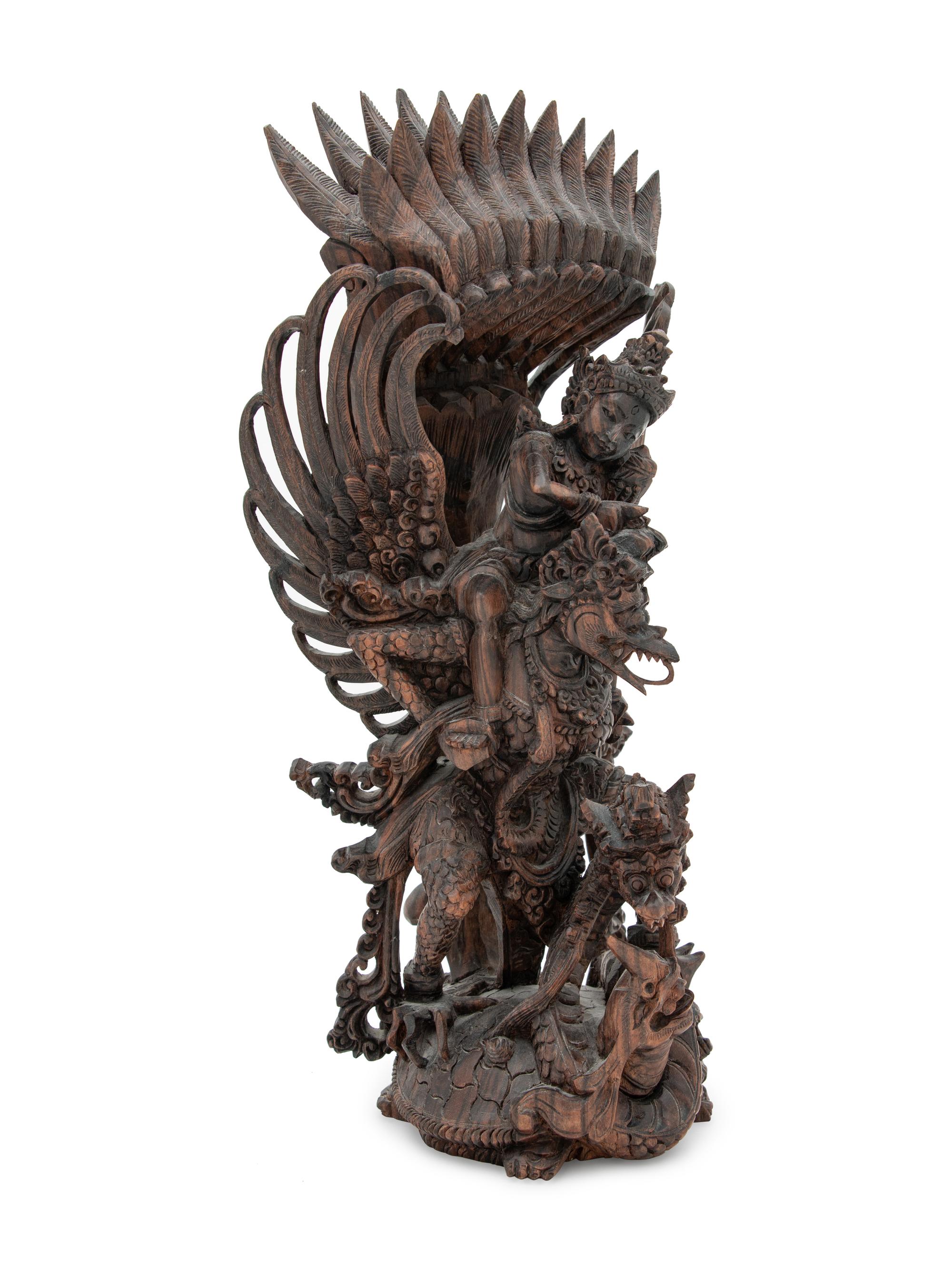 A Thai Carved Wood Figural Group of a Deity and Animals