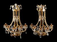 A Pair of French Gilt Bronze and Cut Glass Five-Light Sconces