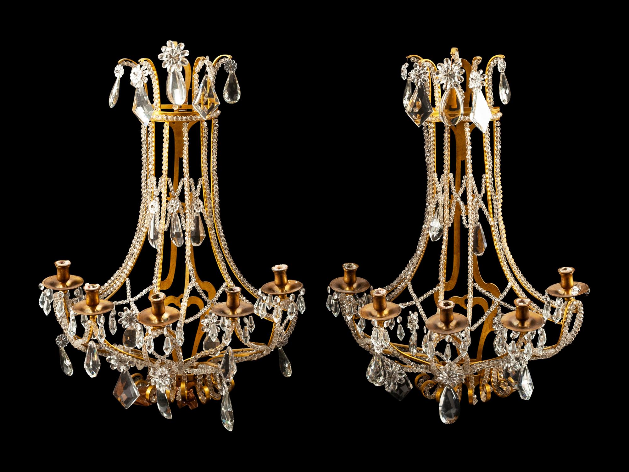 A Pair of French Gilt Bronze and Cut Glass Five-Light Sconces