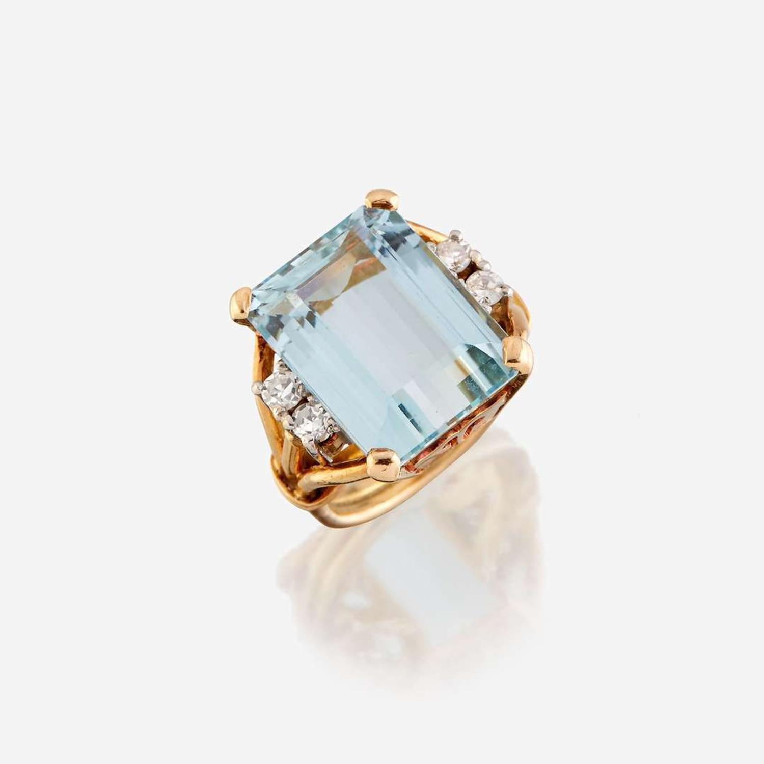 An aquamarine, diamond, and eighteen karat gold ring