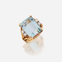 An aquamarine, diamond, and eighteen karat gold ring