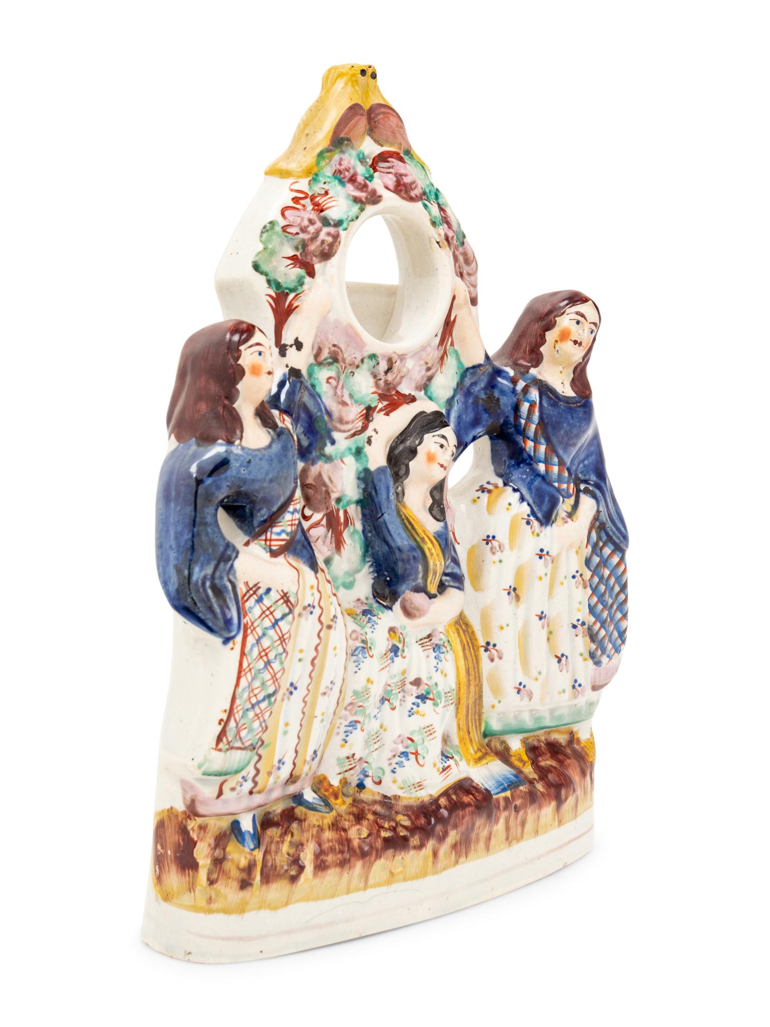 A Stafford Figural Watch Stand