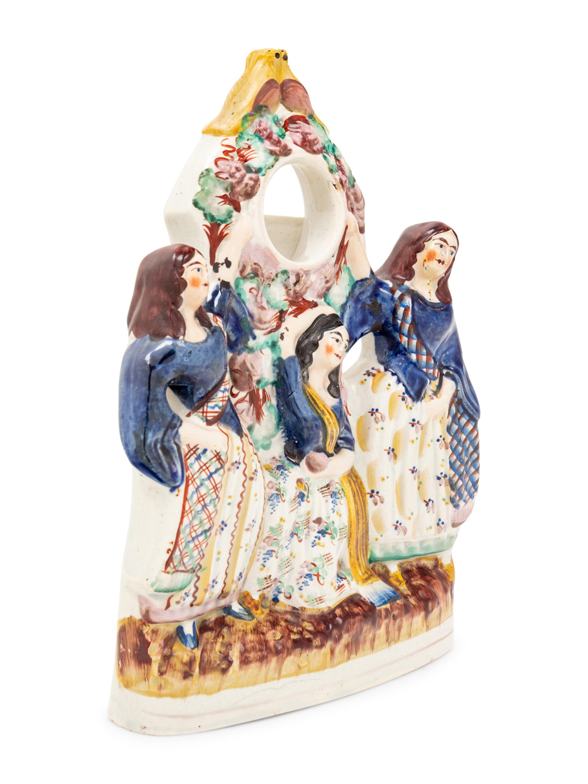 A Stafford Figural Watch Stand
