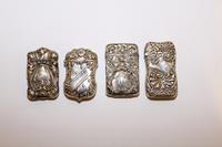 A Group of Four American Silver Vesta Cases, Various Makers, 19th Century, each engraved with monograms and repousse decorated.