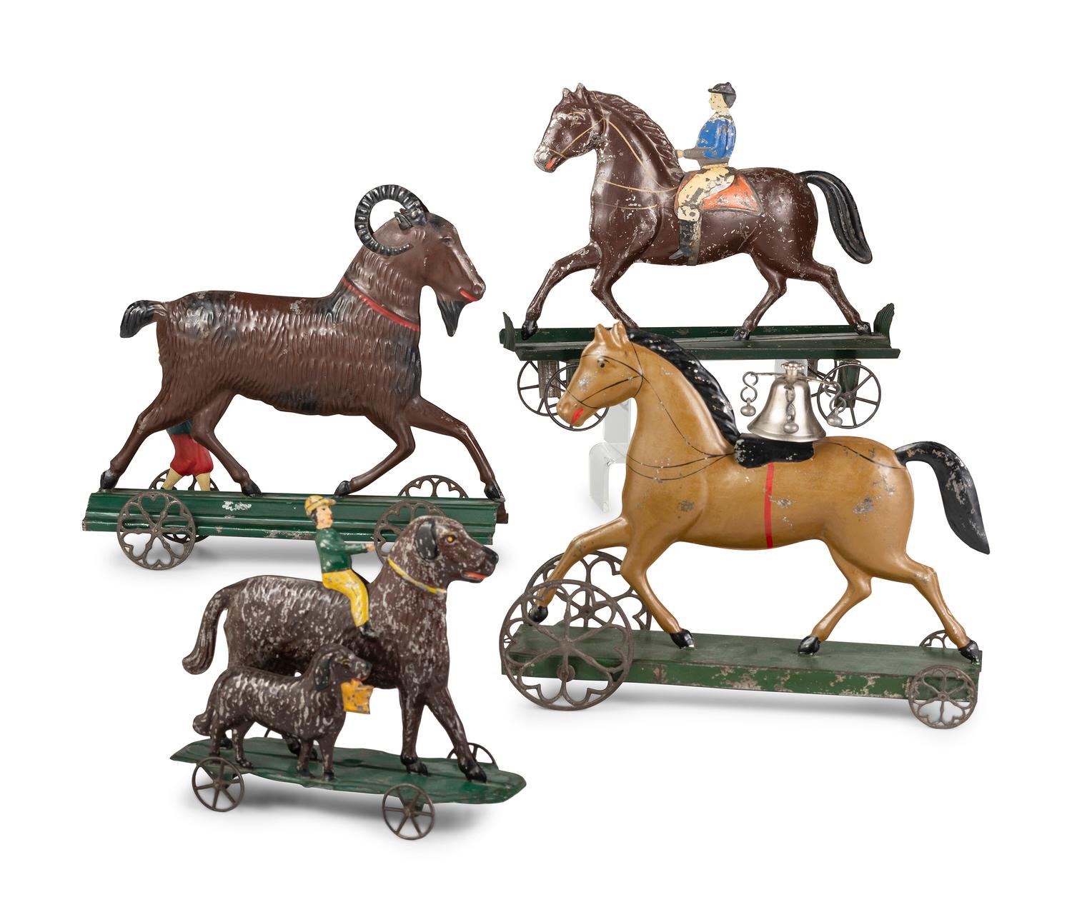 Four Pressed and Painted Tin Figural Pull Toys