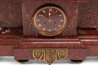 A Monumental French Neoclassical Gilt Bronze and Rouge Marble Clock Garniture