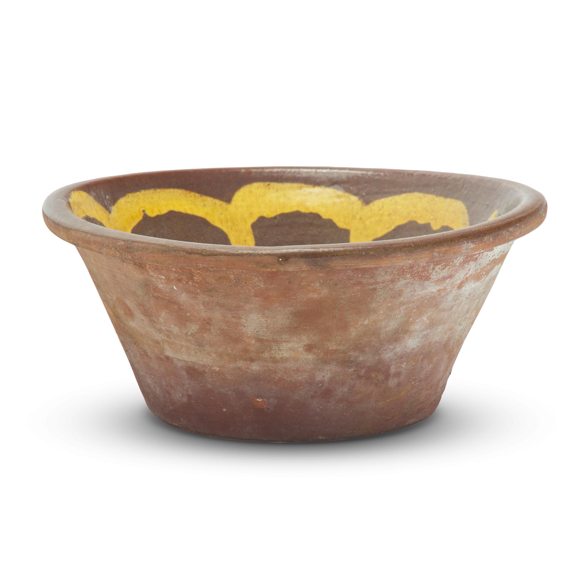 A Glazed and Slip-Decorated Redware Bowl