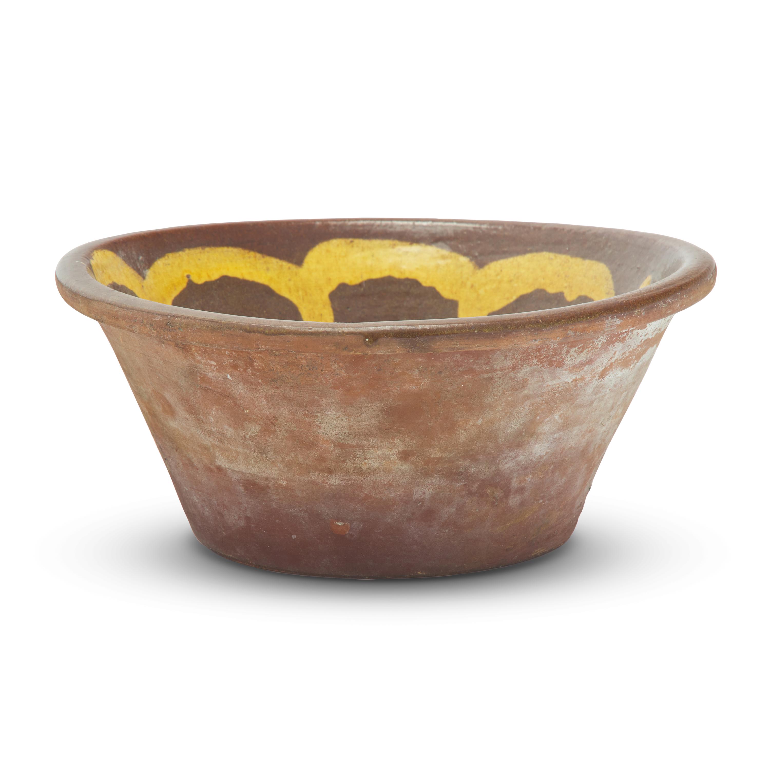 A Glazed and Slip-Decorated Redware Bowl