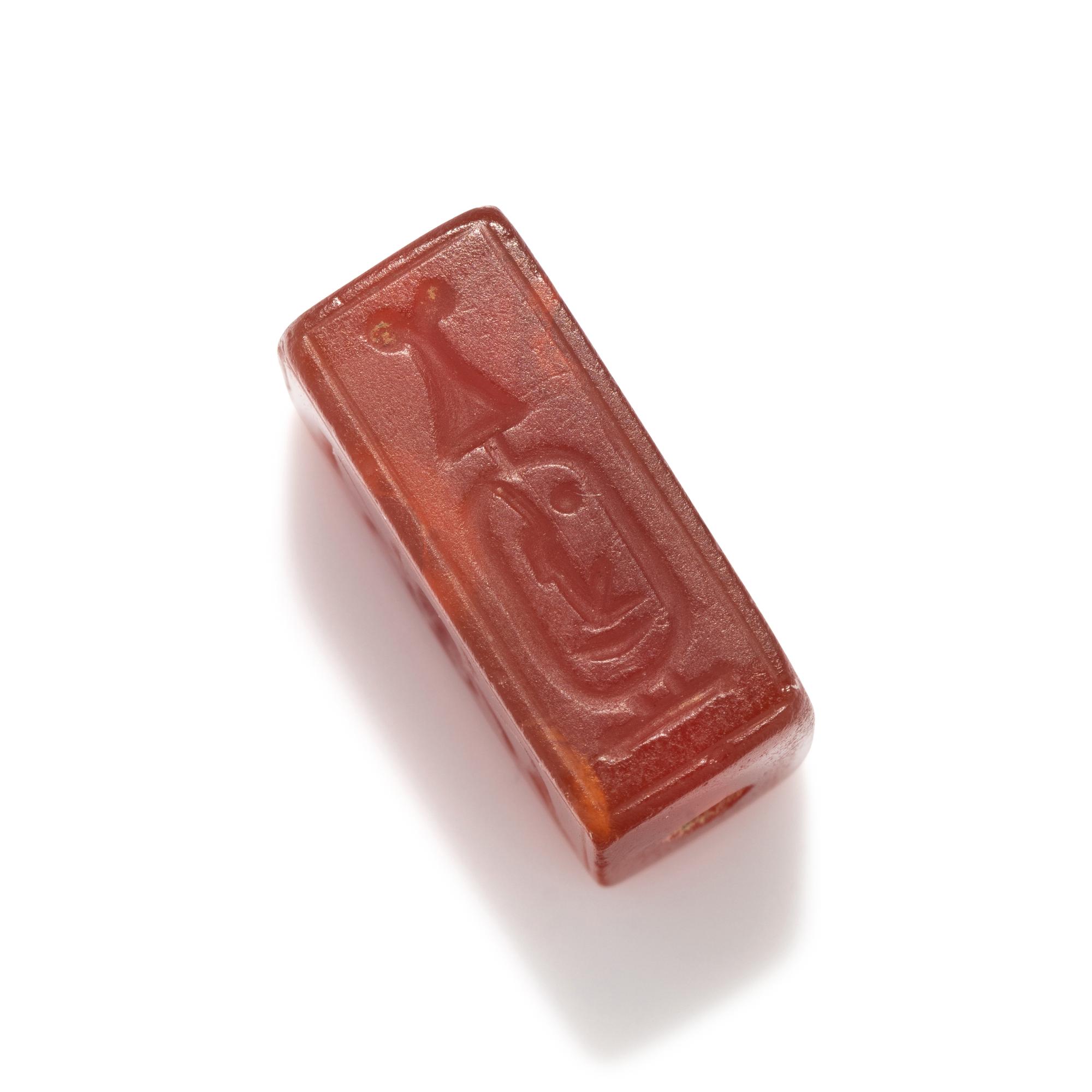An Egyptian Carnelian Incised Bead with the Cartouche of Amenhotep III