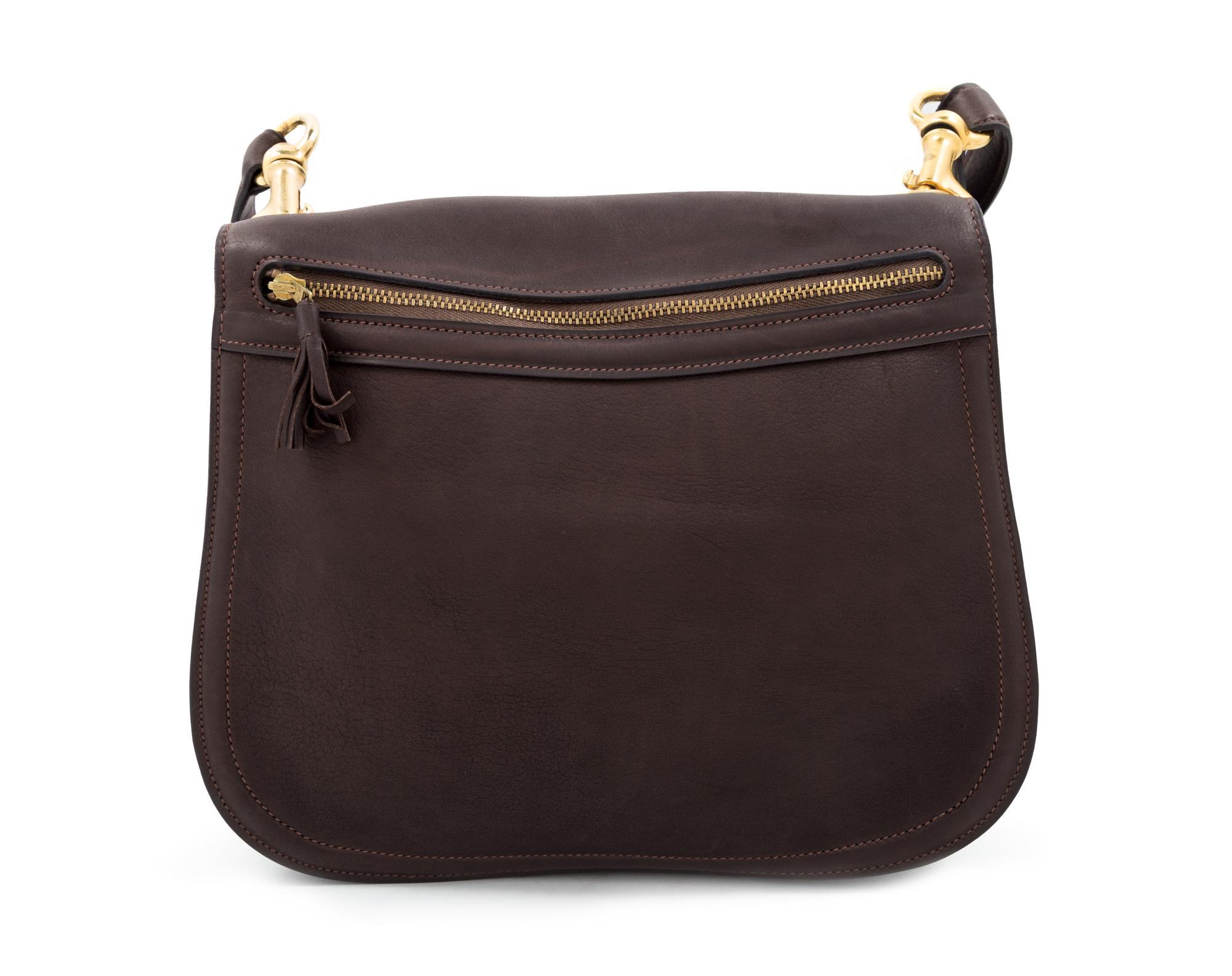 A Gucci Brown Leather Vintage Reversible Saddle Shoulder Bag, 9.75" H x 10.75" W x 2" D; Strap drop: 8.5"- 9".