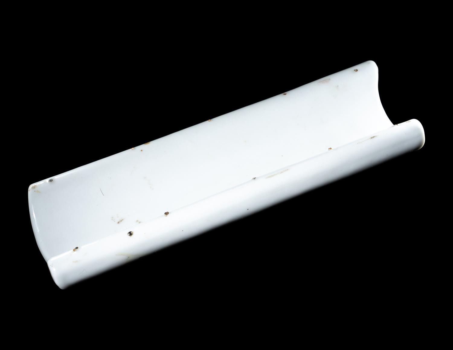 A Famille Rose Porcelain Scroll-Form Wrist Rest
