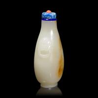 A Chinese Carved White and Russet Jade Snuff Bottle