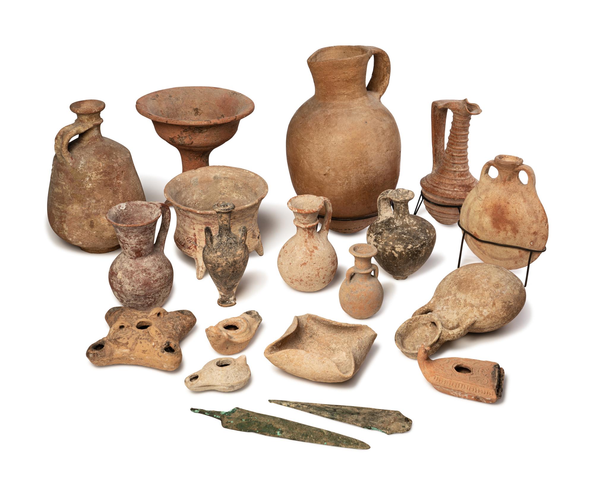 A Group of 19 Holy Land Terracotta Oil Lamps, Pottery, and Bronze Blades