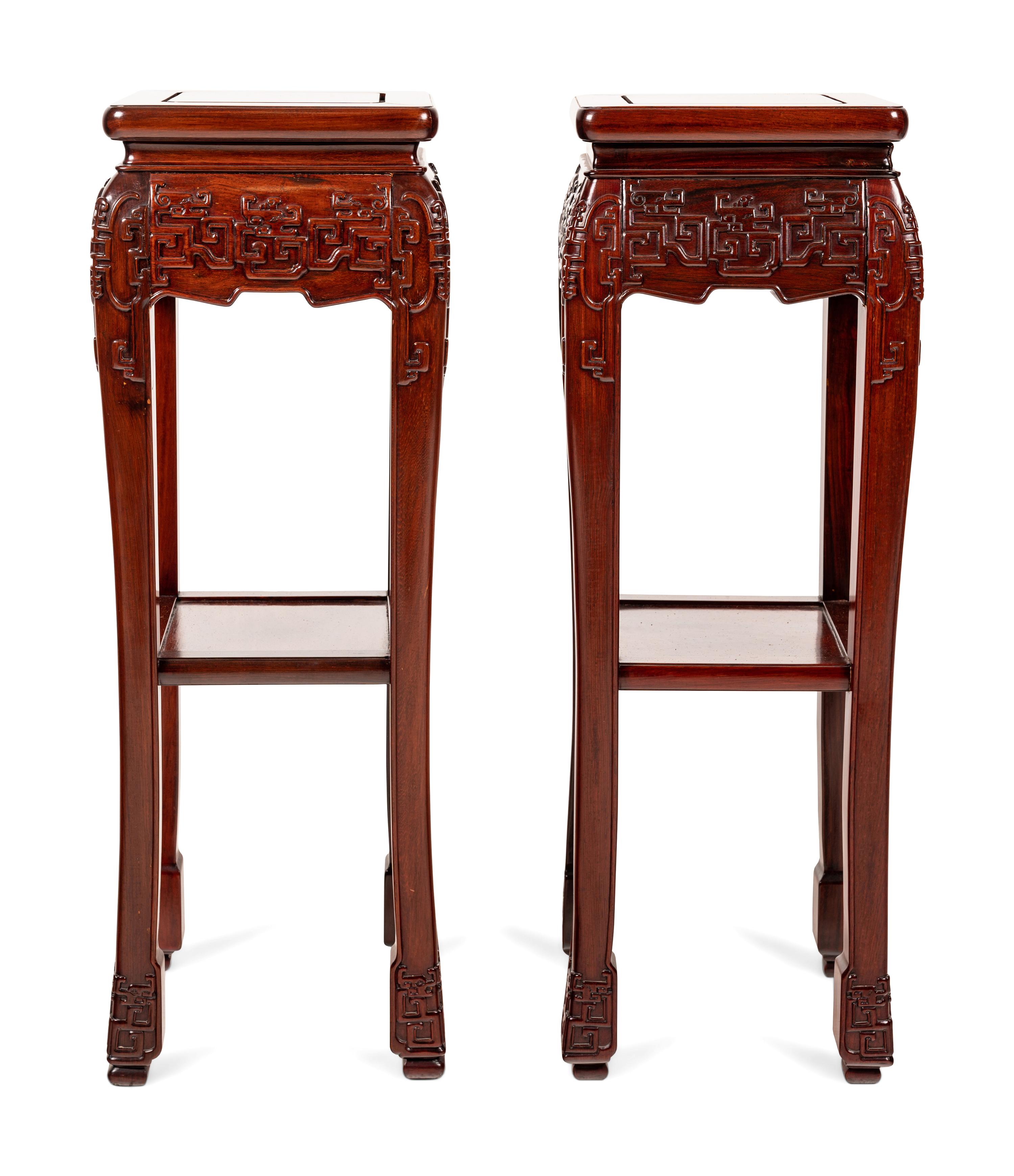 A Pair of Chinese Carved Hardwood Pedestals