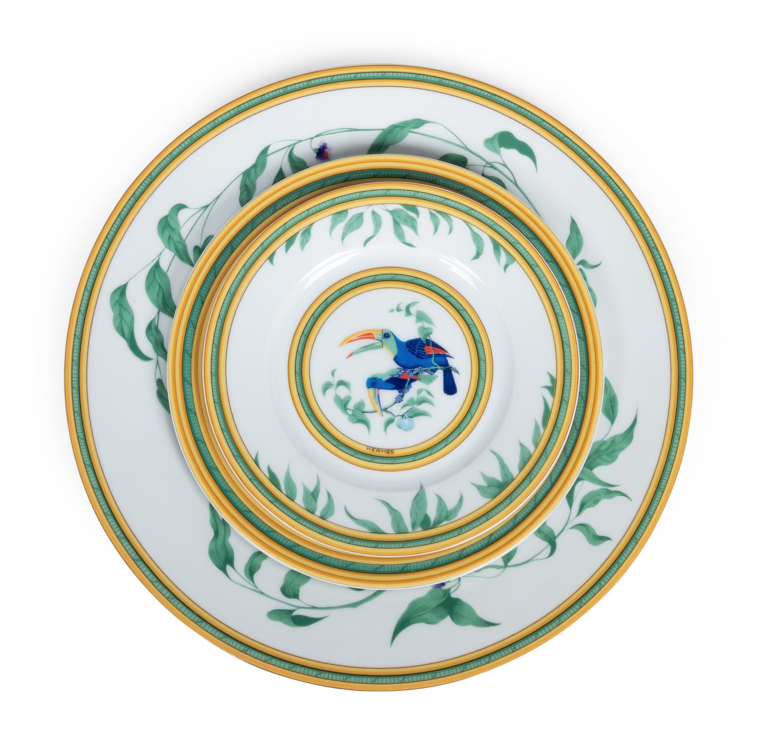 An Hermès Porcelain Toucans Porcelain Dinner Service