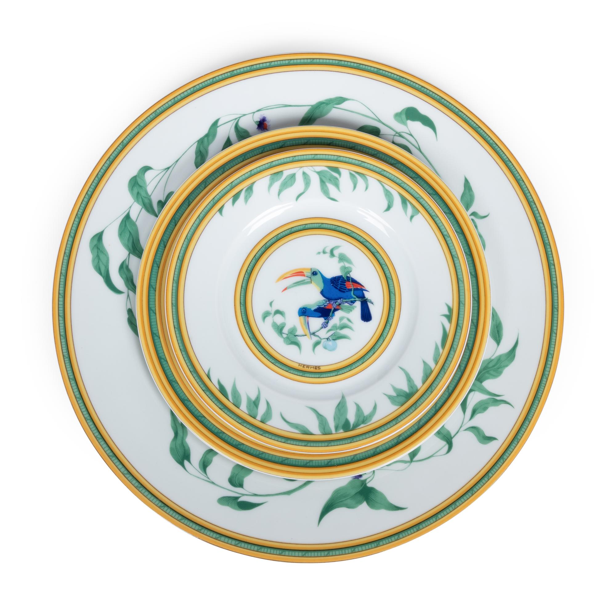 An Hermès Porcelain Toucans Porcelain Dinner Service