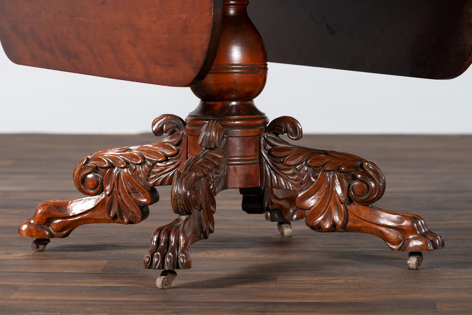 A Classical Highly Carved Cherrywood Drop-Leaf Dining Table