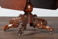 A Classical Highly Carved Cherrywood Drop-Leaf Dining Table