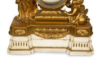 A Louis XVI Gilt Bronze Mounted Marble Mantel Clock