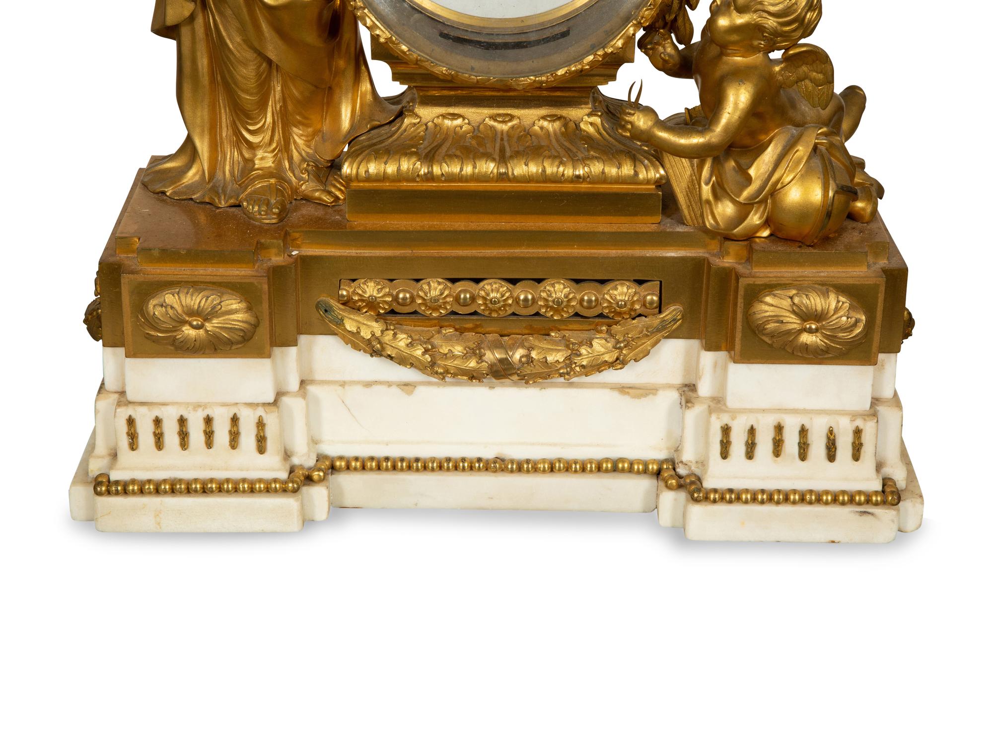 A Louis XVI Gilt Bronze Mounted Marble Mantel Clock