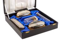 An Edwardian Silver Mounted Five-Piece Dresser Set, H. Matthews, Birmingham, 1902 and Others, comprising three brushes and two silver-m