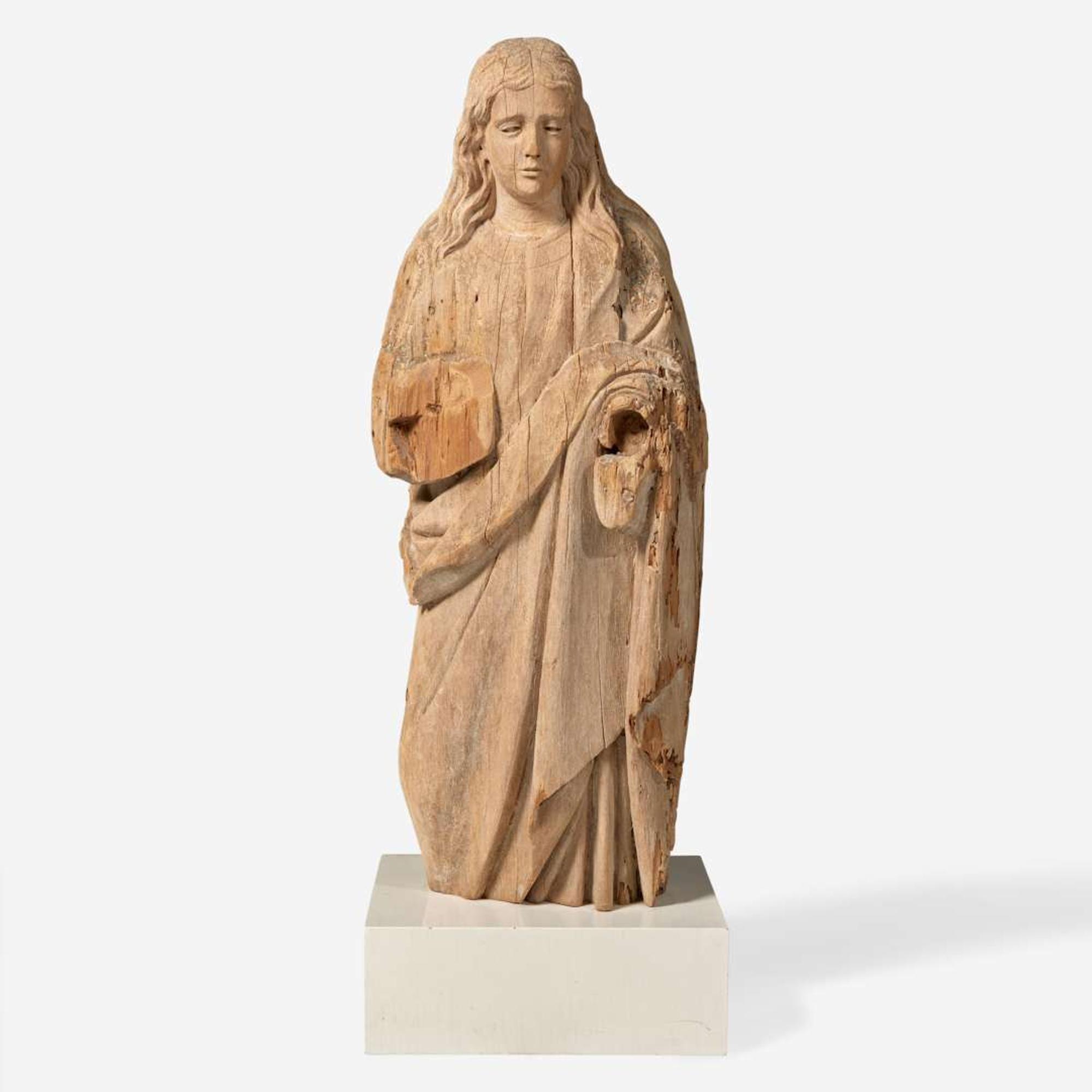 A carved wood figure of a saint Continental, 16th / 17th century