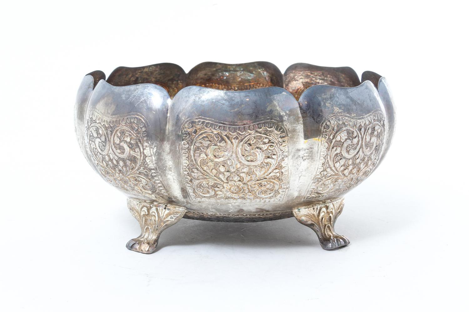 A Southeast Asian Repousse Decorated Silver Bowl, , of lobed footed form, with a fitted box.