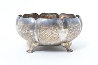A Southeast Asian Repousse Decorated Silver Bowl, , of lobed footed form, with a fitted box.