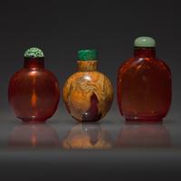 Three Chinese Amber and Root Amber Snuff Bottles, Qing Dynasty, 18th-19th Century — 清中期 琥珀鼻煙壺三支