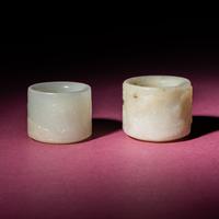 Two Chinese White Jade Carved and Inscribed Archer's Rings, 18th/19th Century — 清中期 白玉扳指兩枚