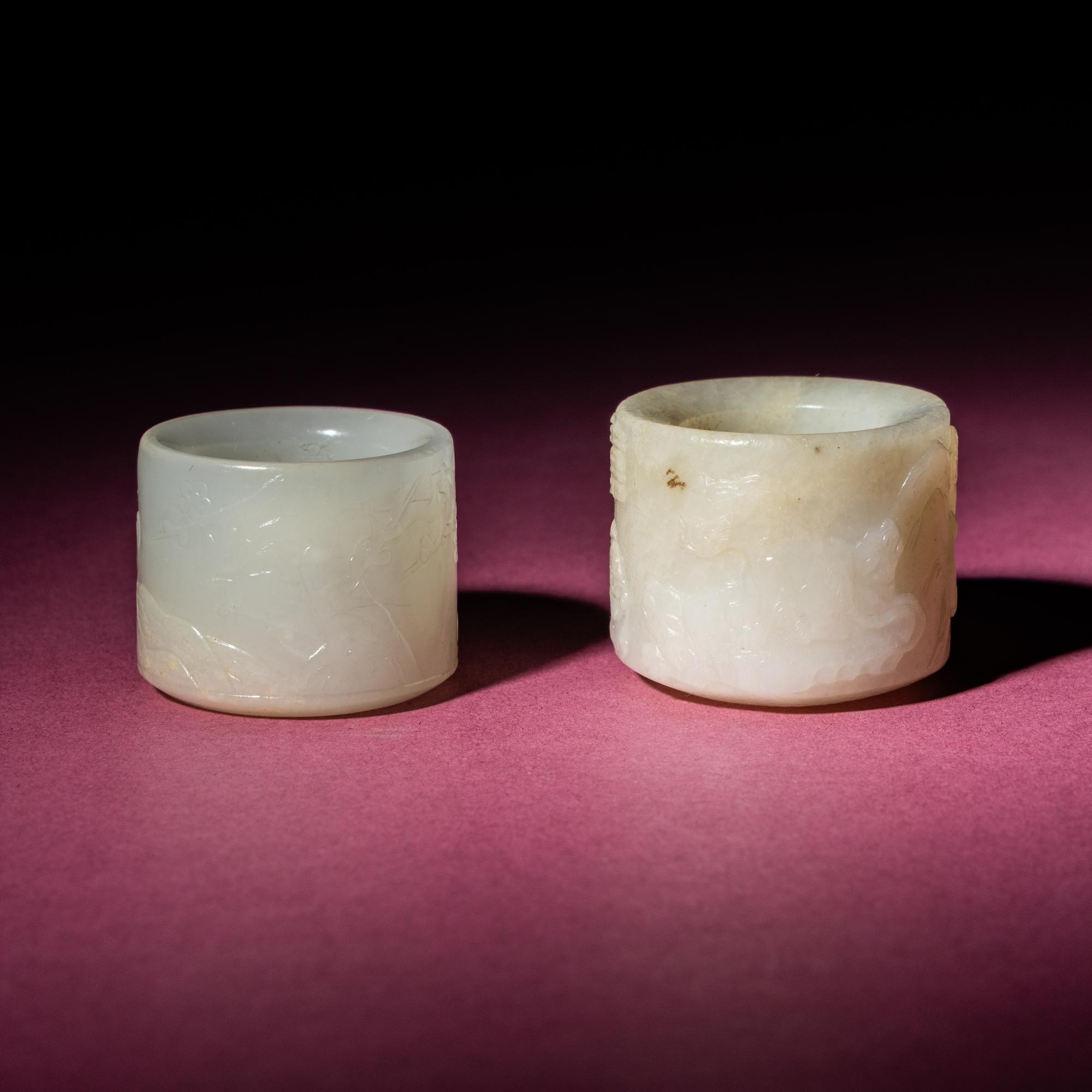 Two Chinese White Jade Carved and Inscribed Archer's Rings, 18th/19th Century — 清中期 白玉扳指兩枚