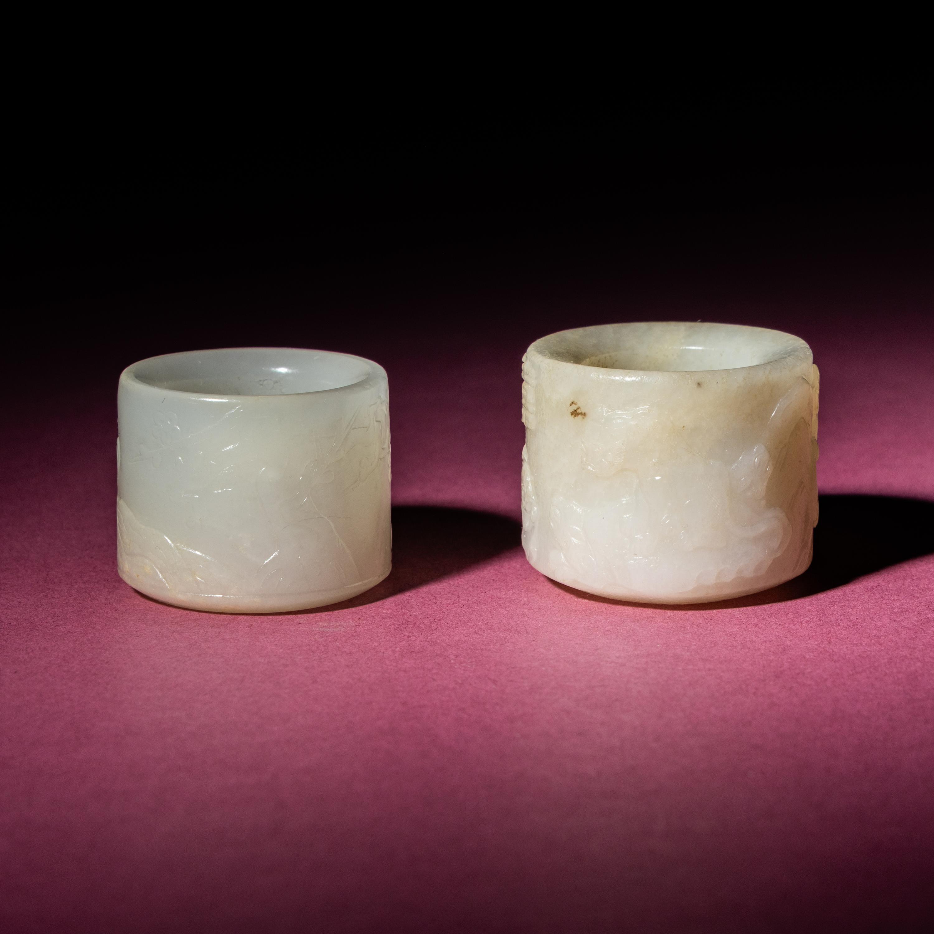 Two Chinese White Jade Carved and Inscribed Archer's Rings, 18th/19th Century — 清中期 白玉扳指兩枚