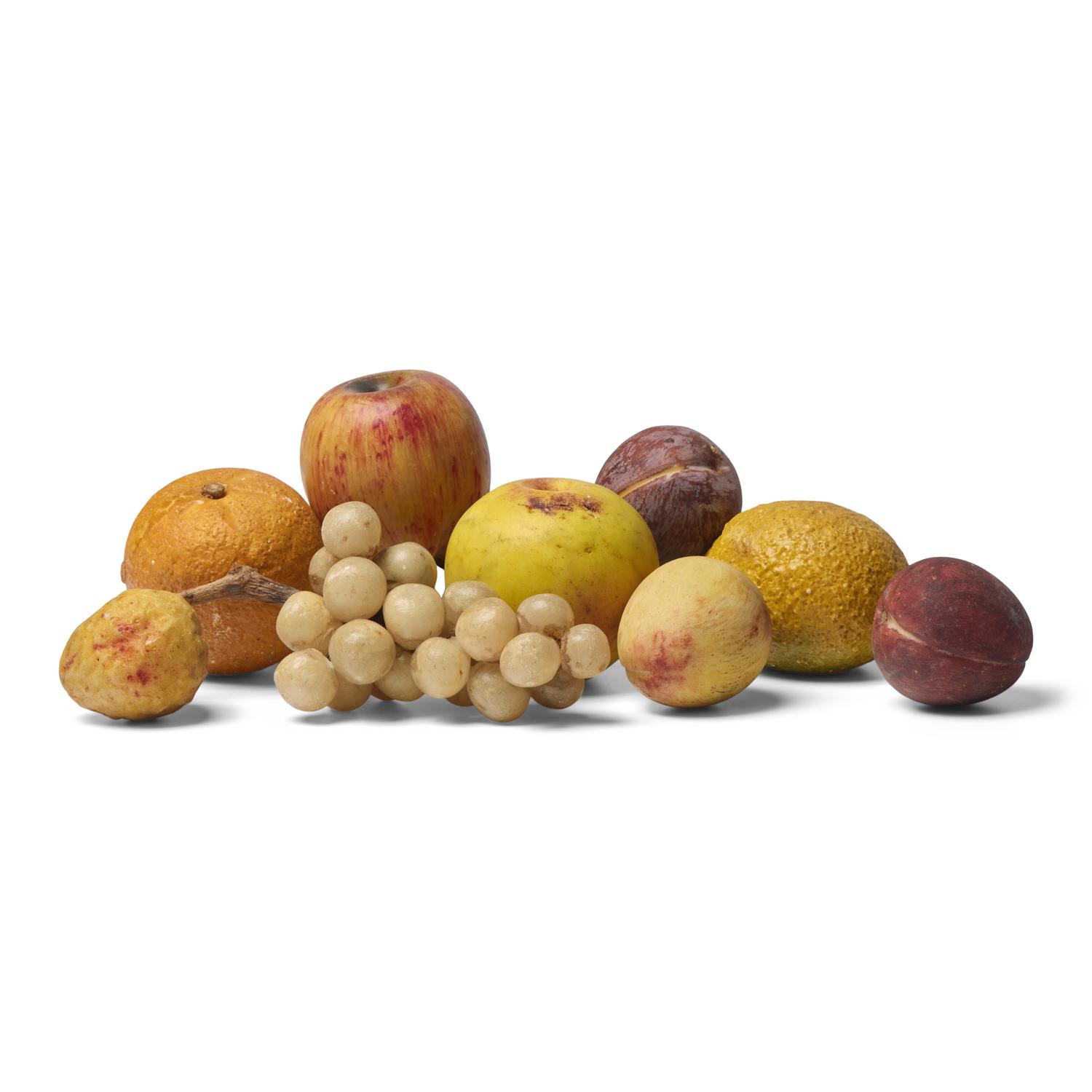 A Group of Nine Pieces of Painted Stone Fruit