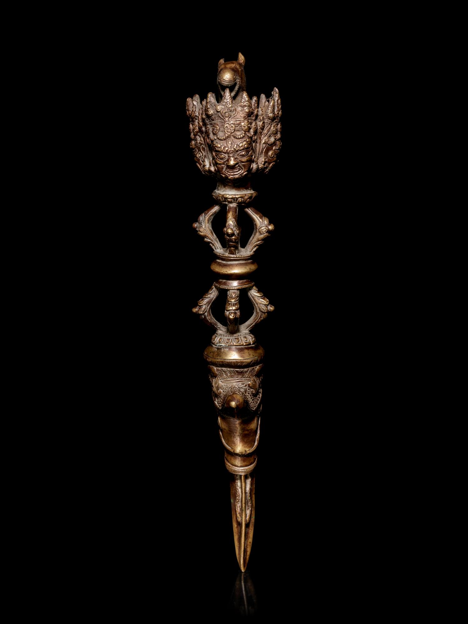 A Tibetan Gilt Bronze Phurba