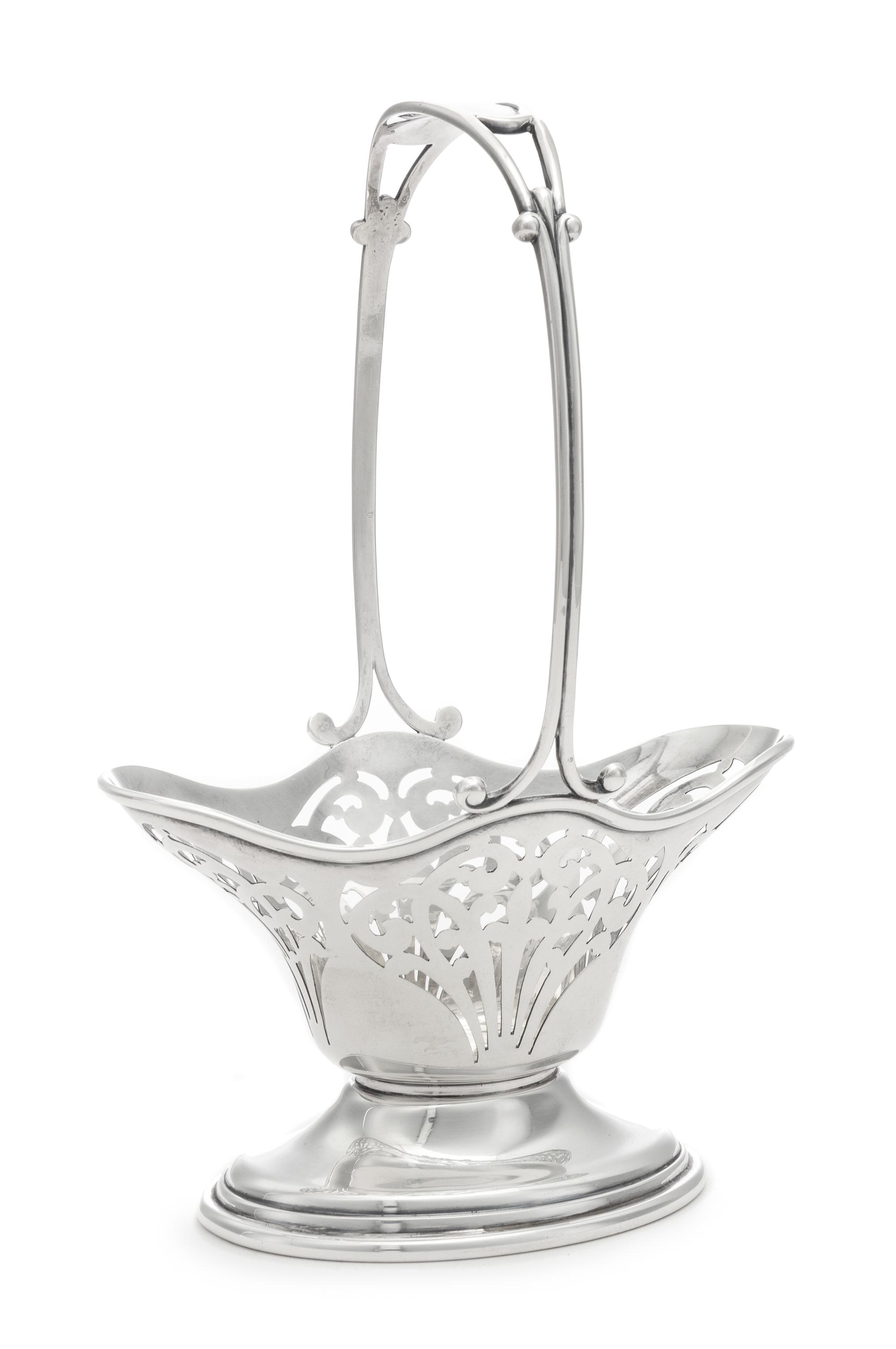An American Silver Basket, William B. Durgin Co., Providence, RI, 20th Century, having a fixed handle and a pierced body.