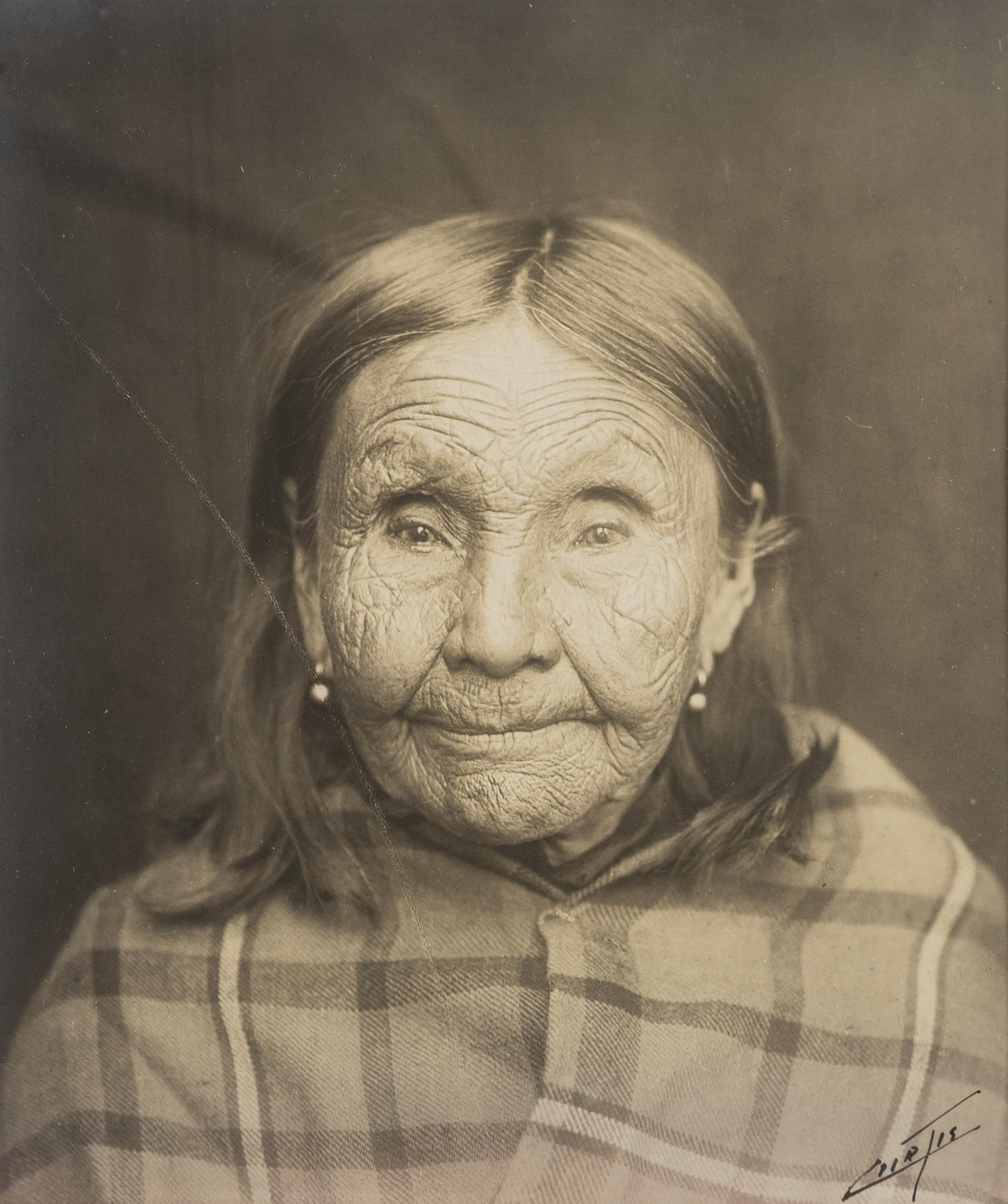 Edward S. Curtis (1868-1952) Untitled portrait (Native American Woman in Plaid Shawl,) c. 1900