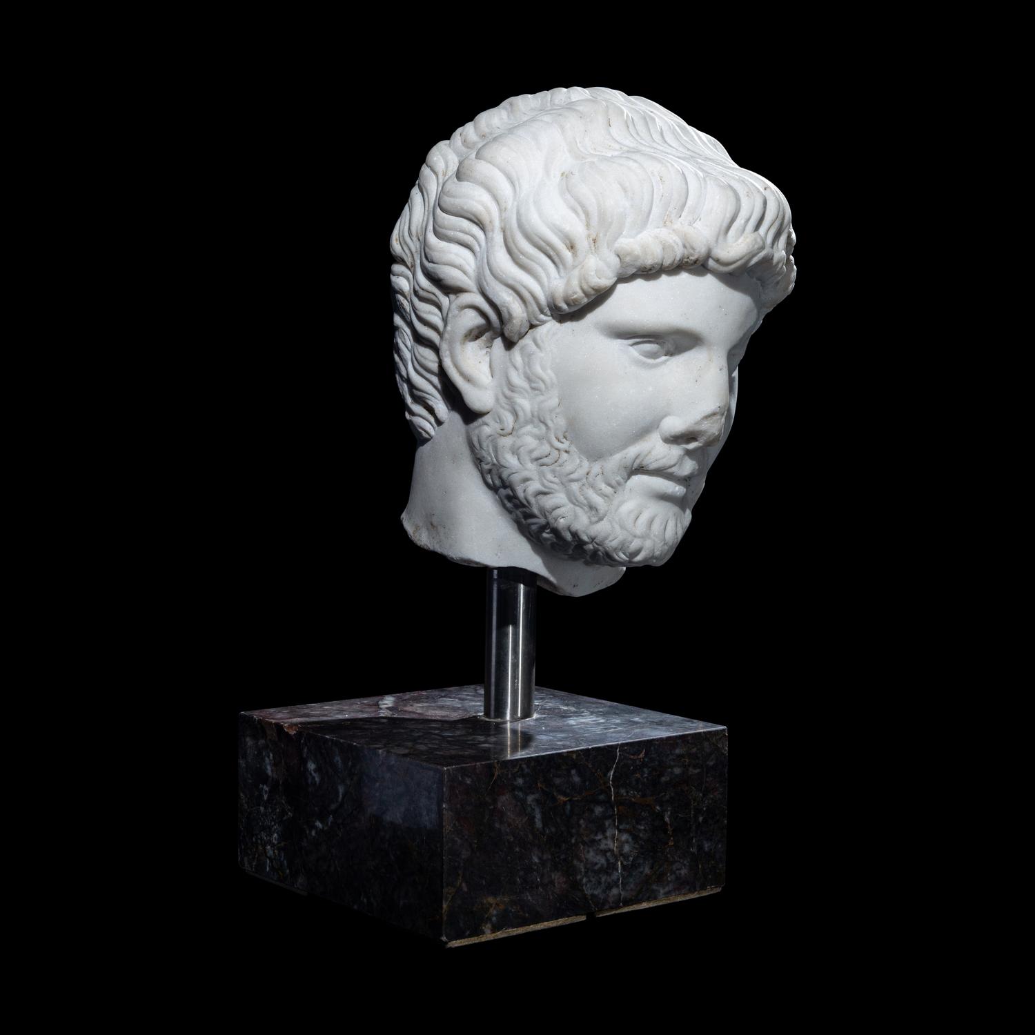 An Over Life-Size Roman Marble Portrait Head of Emperor Hadrian