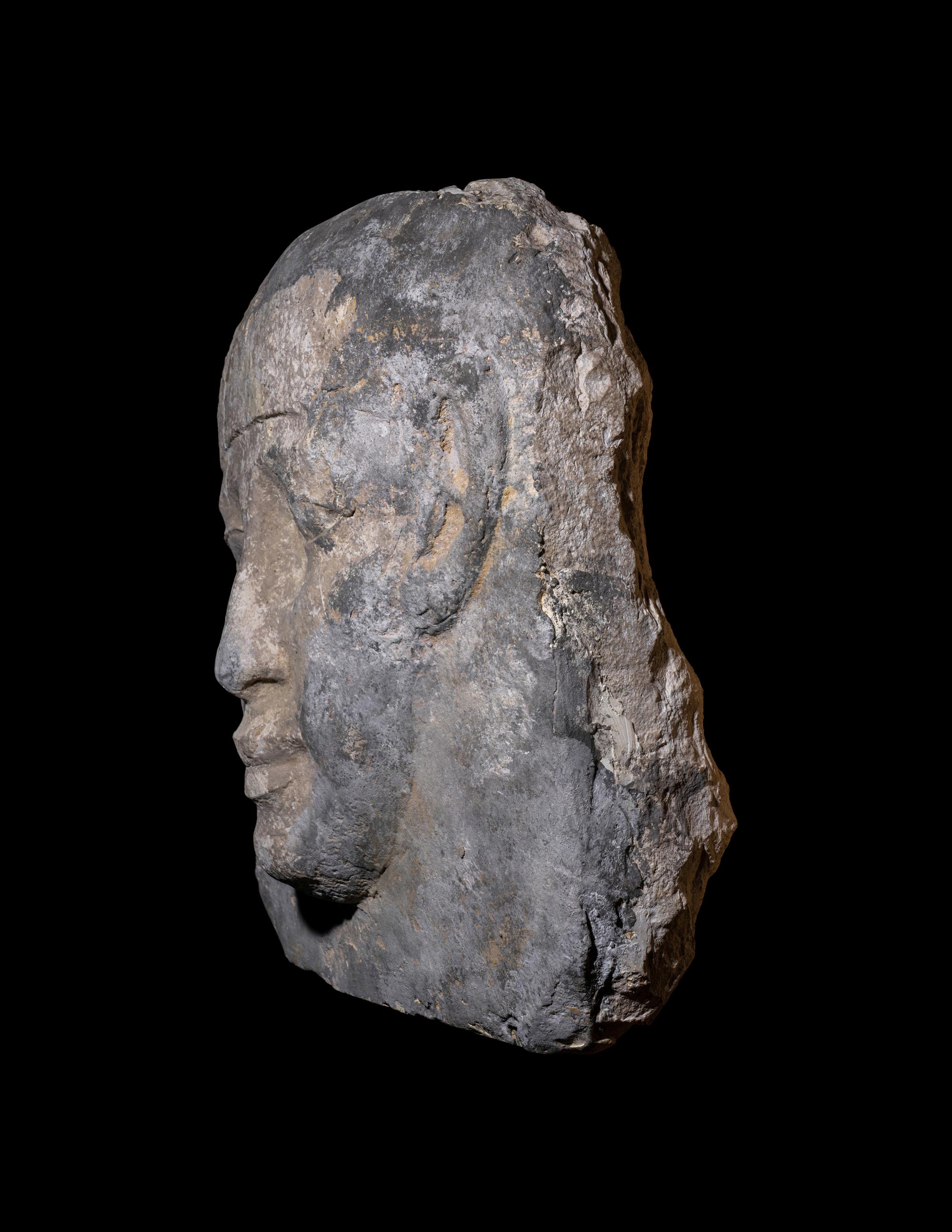 An Egyptian Limestone Mask from an Anthropoid Sarcophagus