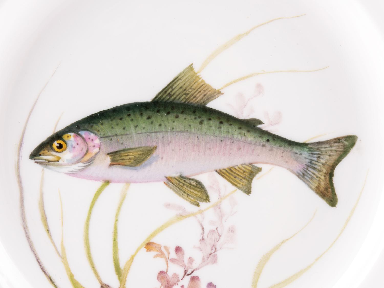 A Set of Twelve Royal Copenhagen Parcel Gilt Porcelain Fish Plates