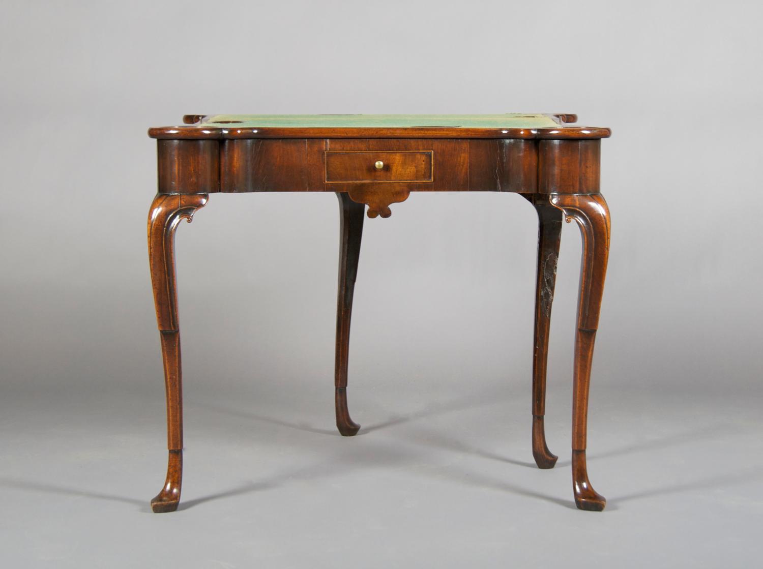 A Mahogany Games Table, Height 28 1/2 x width 33 1/2 x depth (closed) 16 1/2 inches.