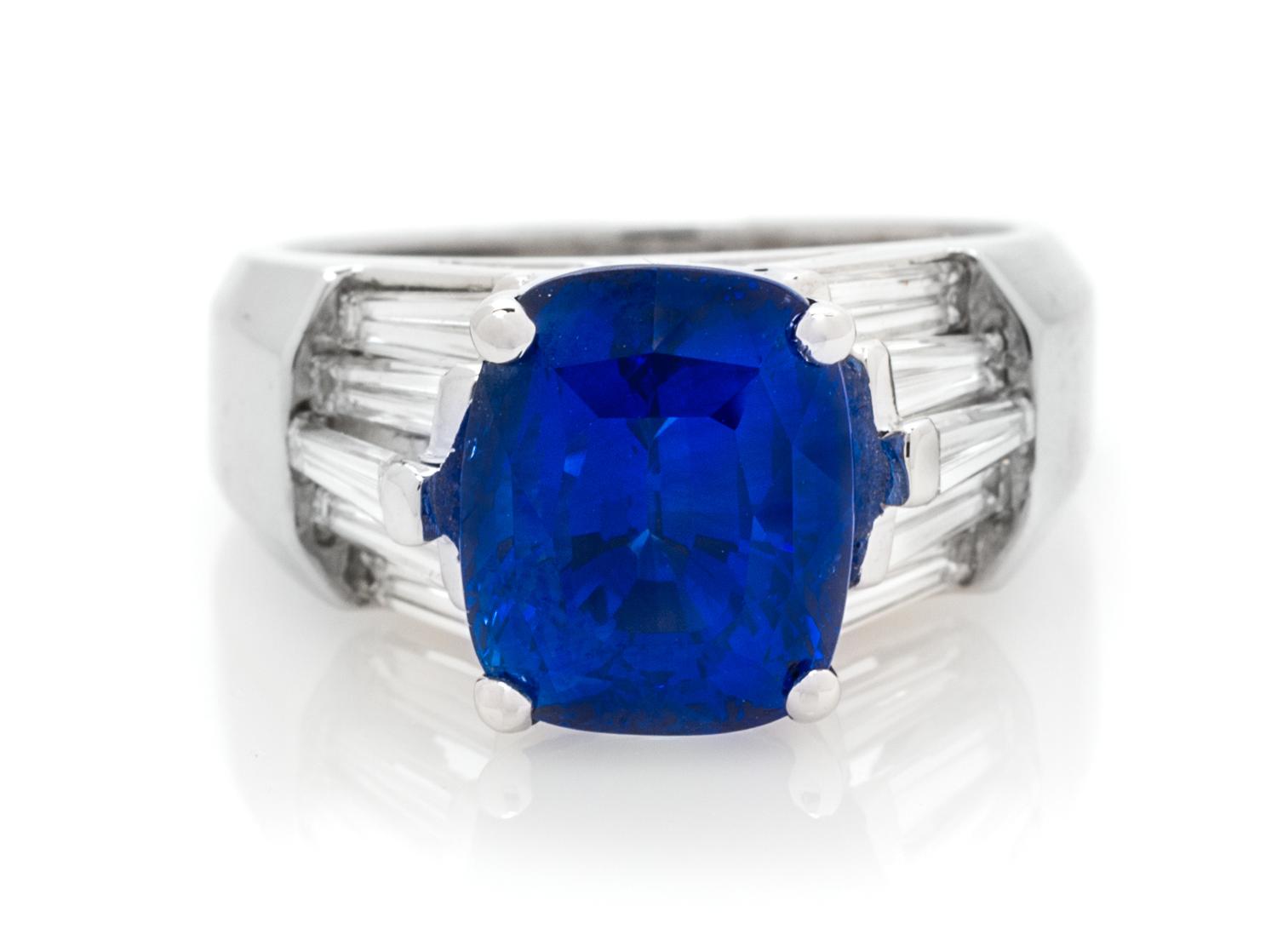 An 18 Karat White Gold, Sapphire and Diamond Ring, 8.20 dwts.