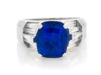 An 18 Karat White Gold, Sapphire and Diamond Ring, 8.20 dwts.