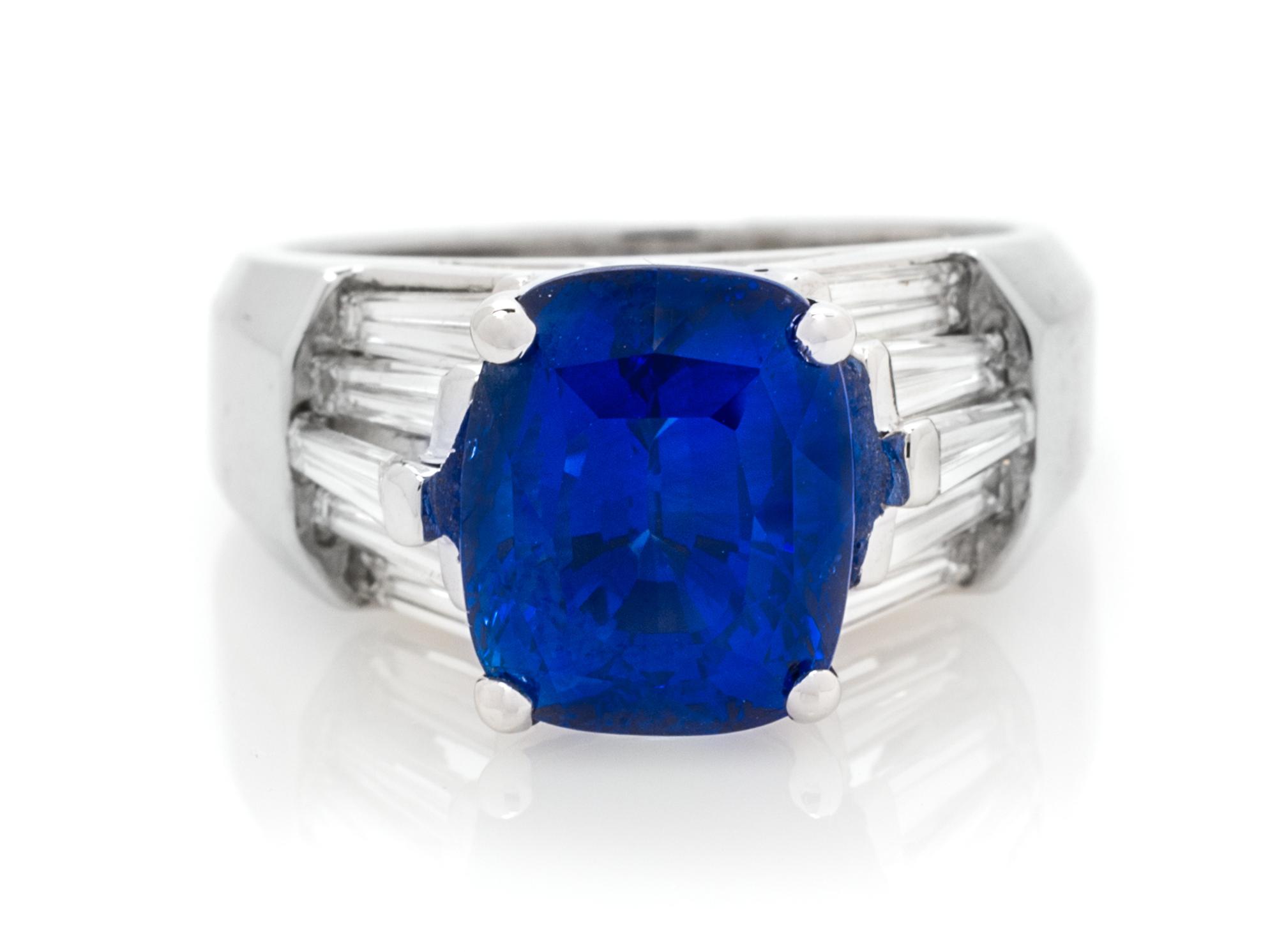 An 18 Karat White Gold, Sapphire and Diamond Ring, 8.20 dwts.