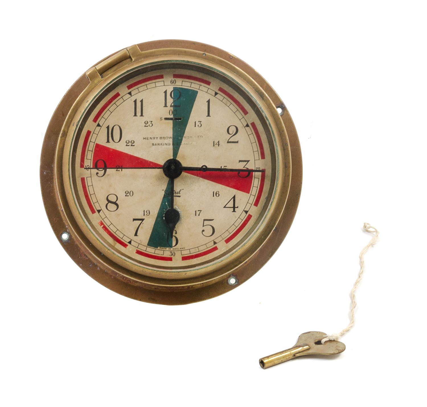 An English Brass Cased Ship's Bulkhead Clock Diameter of face 5 3/4 inches. — HENRY BROWN & SON LTD., LONDON, MOVEMENT BY ELLIOTT, EARLY 20TH CENTURY