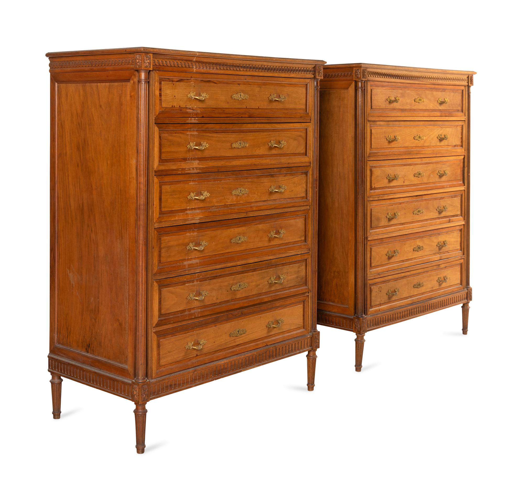 A Pair of Louis XVI Style Walnut Chests-of-Drawers