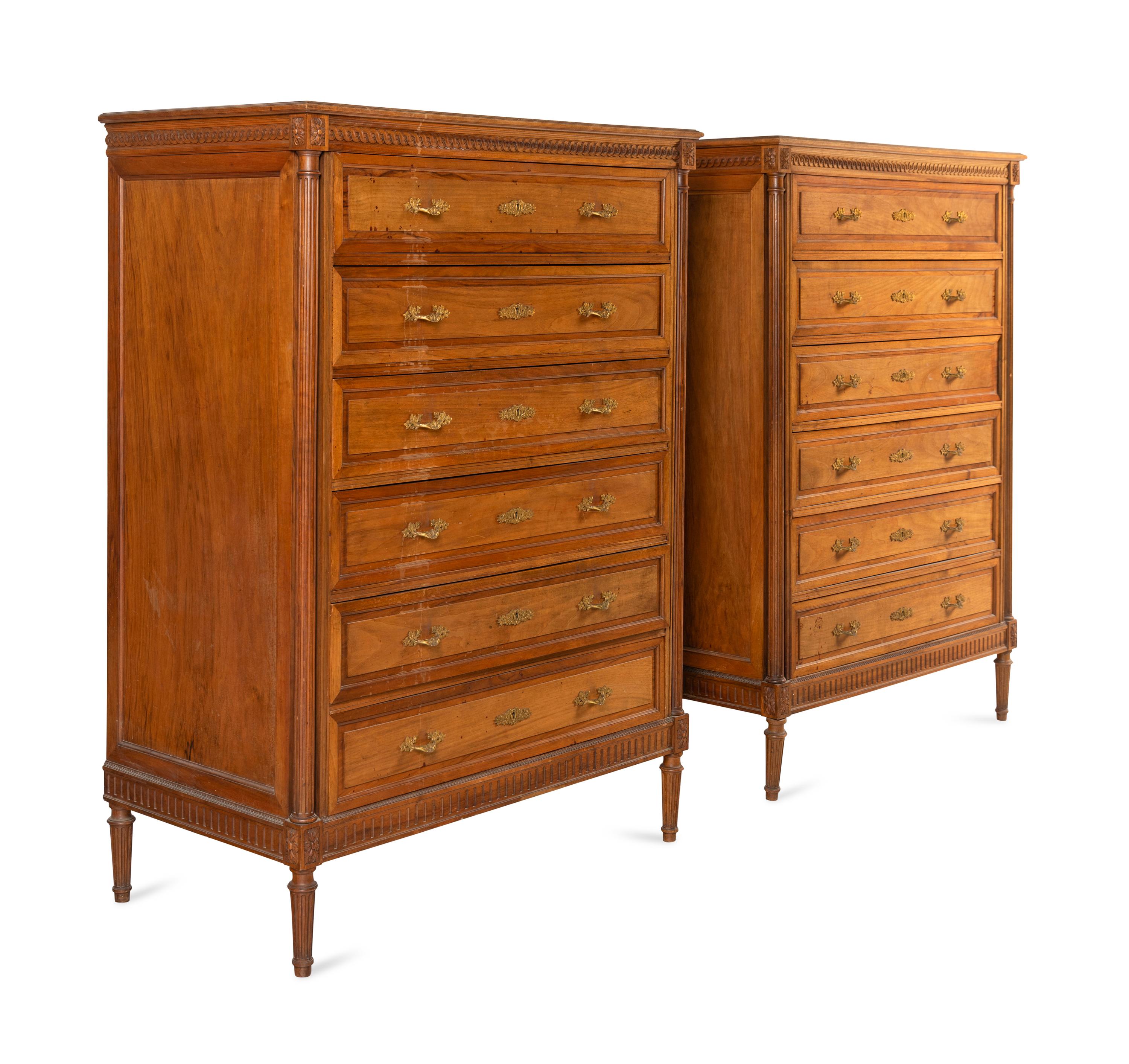 A Pair of Louis XVI Style Walnut Chests-of-Drawers