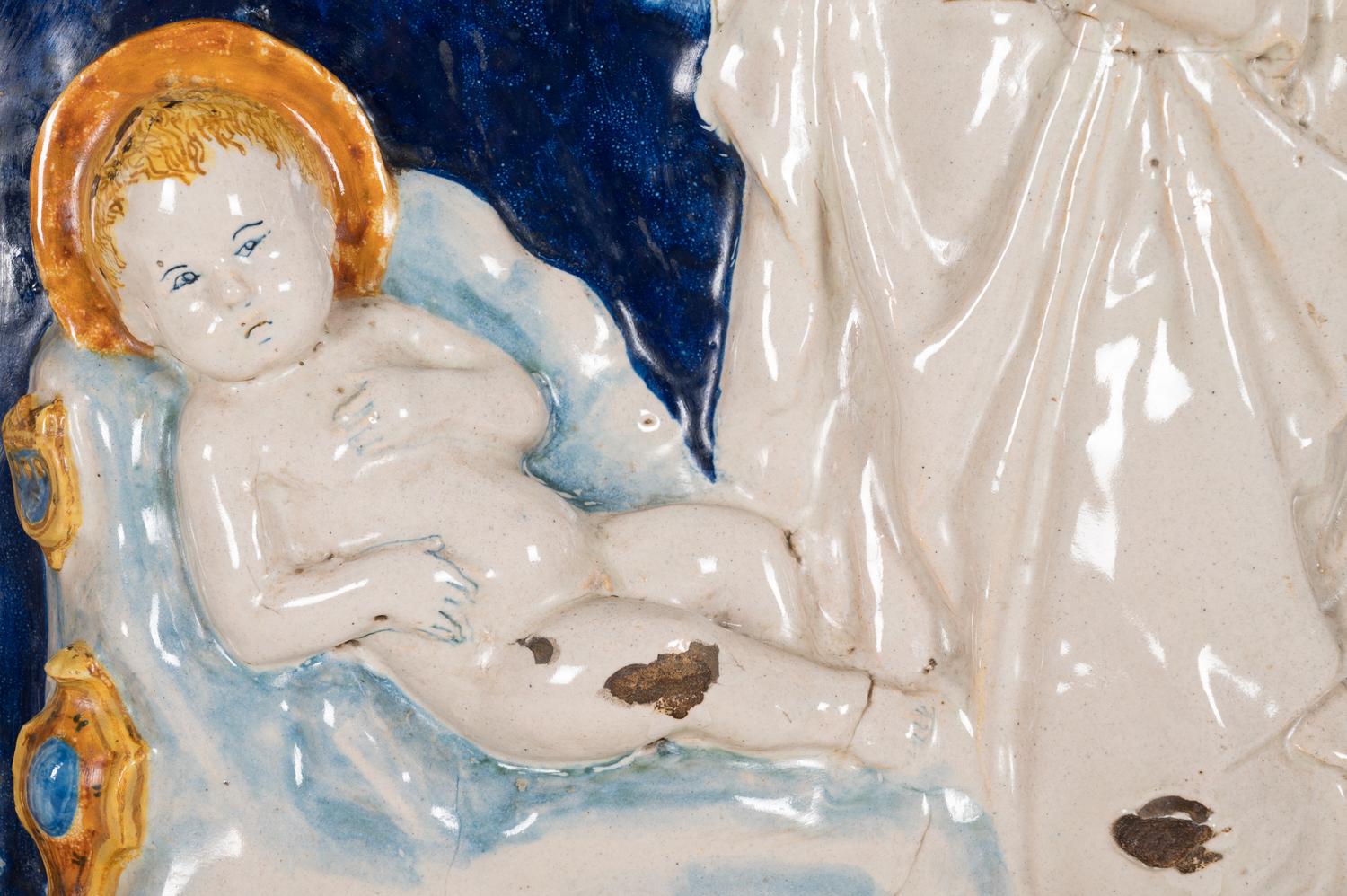 An Italian Glazed Earthenware Plaque of the Madonna and Child